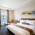 City Lodge Hotel Grandwest in Cape Town room with double bed, desk, chair, sofa and window view