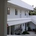Mansion Giahn Bed & Breakfast in Cancún, white two-story hotel exterior with balcony and stairway