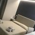 Hotel Timpe Bianche San Vito Lo Capo guest room with bed, lamp and modern headboard in Castelluzzo