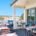 Campanile Melun Sud - Dammarie les Lys terrace with outdoor tables, chairs, and open countryside views