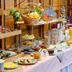 Breakfast buffet at Komforthotel & Restaurant Riemann in Bad Lauterberg with baskets of fruit and pastries