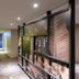 Tinidee Trendy Bangkok Khaosan hallway with colorful patterned carpet and art wall in Bangkok