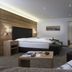 Das Lafairs in Pfunds: modern guest room with bed, wall-mounted TV and seating area