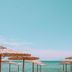 Georgalas Sun Beach Resort in Nea Kallikratia with straw beach umbrellas and sea view