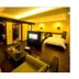 The Pearl Boutique Hotel Lishui suite with bed, seating area and TV in Lishui