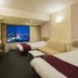 Asahikawa Park Hotel room with twin beds and city view at night in Asahikawa