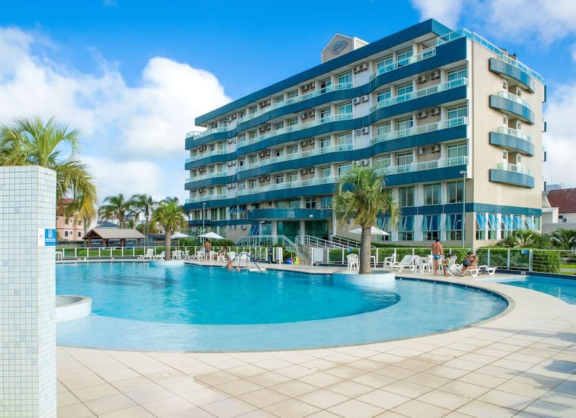Oceania Park Hotel Spa & Convention in Florianopolis with outdoor pool and palm trees