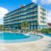 Oceania Park Hotel Spa & Convention in Florianopolis with outdoor pool and palm trees