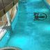 Indoor pool at Hotel & Spa Wasserschloss Westerburg in Huy with turquoise water and stone wall