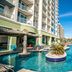 Towers at North Myrtle Beach pool area with lazy river, loungers, and oceanfront deck