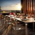 Home2 Suites by Hilton Albuquerque Airport rooftop terrace dining with sunset and mountain views in Albuquerque