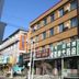 Center Of City Creo Hotel in Yanbian, street-view exterior of a corner building with Korean and Chinese signage