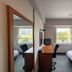 GR Hotel Ginzadori in Kumamoto guest room with twin beds, desk, chair, and city-view window