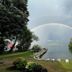 The Villas on Lake George in Diamond Point with lakeside dock, lounge chairs, and rainbow over the water