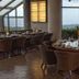 Canyon Woods Resort Club in Laurel dining room with round table settings and mountain views