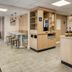 Premiere Classe Bordeaux Sud Villenave D'ornon breakfast area with tables, chairs and self-serve station