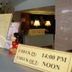 Ideal Hotel Pratunam Bangkok front desk with check-in and check-out time sign