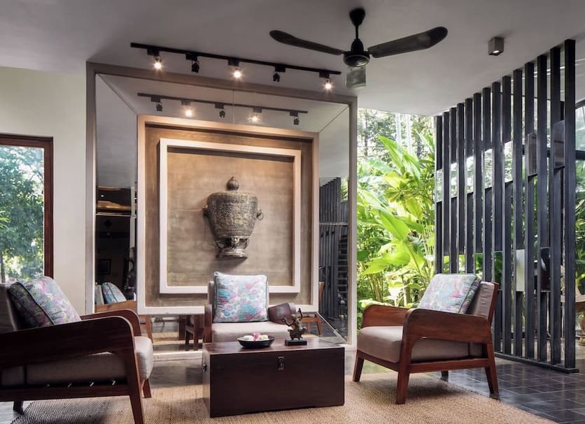 Lynnaya Urban River Resort Siem Reap lounge with framed wall art, seating, and tropical garden view