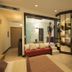 Thotel Lamezia in Feroleto Antico guest room with sofa, desk, wall TV and glass-enclosed bathroom