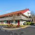 Red Roof Inn Danville, PA exterior with red roof, two-story motel building and parking lot