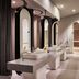 Premier Residences Phu Quoc Emerald Bay bathroom with double sinks, arched mirrors and shower stalls