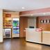 TownePlace Suites by Marriott Macon Mercer University lobby front desk with drink coolers in Macon