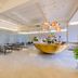 Pace Hotel Suzhou Renmin Road lobby with glass-block wall and large boat-shaped reception desk