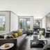 The Murray, Hong Kong, a Niccolo Hotel suite with city views, sofa, and wall-mounted TV