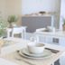 I Giardini della Castellana in Marina di Ragusa dining room with white tables, chairs, and potted herbs