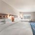 Four Points by Sheraton Elkhart guest room with two beds, desk, wall TV and window view