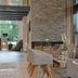 Parkhotel Oberhausen lobby lounge with fireplace, large windows and modern seating in Oberhausen