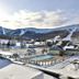 Killington Grand Resort Hotel in Killington with snowy mountain slopes and an outdoor pool
