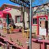 Grand Canyon West Hotel Sheps Miners Inn in Chloride, rustic patio dining area with tables and wagon wheel decor
