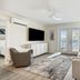 Seahorse Oceanfront Inn in Neptune Beach: bright oceanfront suite with balcony doors and seating area