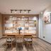 Hanting Hotel Dongguan Changan Wanda in Dongguan, modern dining area with wood tables and wall shelves