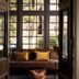 Hotel Belvedere in Kingston lobby nook with brown sofa, yellow pillows, and tall windows