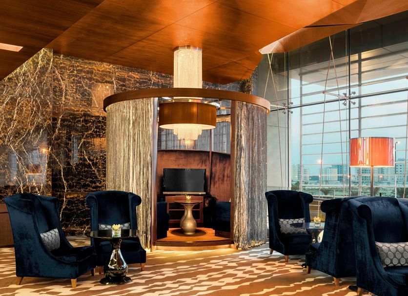 The Westin City Centre Bahrain lounge in Manama with velvet chairs and city views