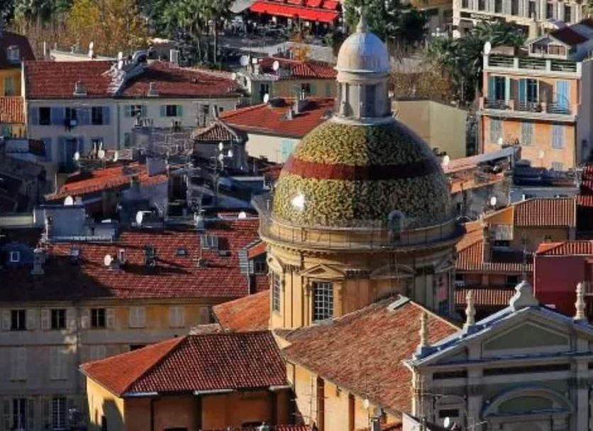Hotel Rossetti in Nice with rooftop views over red-tiled rooftops and a domed building