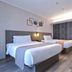 Home Inn Plus Foshan Shunde Qinghui Garden Rt-Mart guest room with two twin beds in Foshan