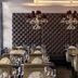 Mercure Hotel & Residenz Frankfurt Messe restaurant with tufted wall and set dining tables