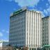 Holiday Inn Metairie New Orleans by IHG hotel exterior in Metairie against a blue sky