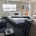 Anchor Lodge Motel in Coromandel, guest room with two beds, seating area and open doorway