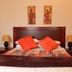 Oak Rest Guesthouse in Kimberley bedroom with double bed, bedside lamps and warm decor