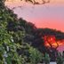 Hotel Parco Conte in Casamicciola Terme with sunset views over trees and hillside