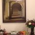 De Utrechtsche Dom in Gouda lobby with framed archway artwork, table, fruit bowl and floral arrangement