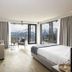 Hotel Olangerhof in Valdaora: modern room with balcony, mountain views, sofa, and bed