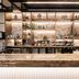 ibis World Trade Centre Dubai bar with stocked shelves and stone counter in Dubai