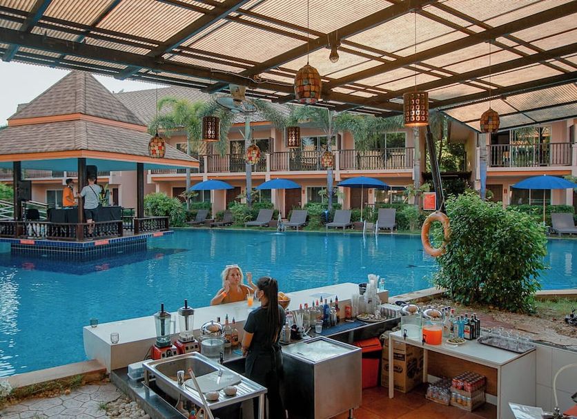 Chivatara Resort & Spa Bang Tao Beach in Choeng Thale with poolside bar and tropical pool view