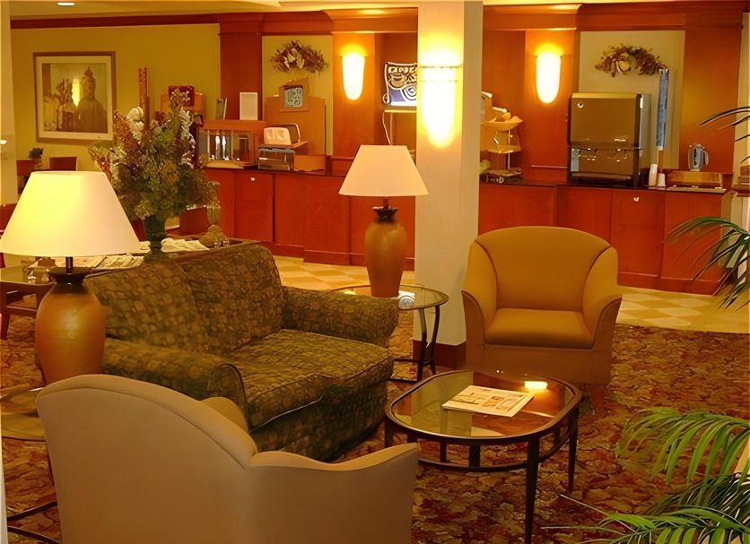 Holiday Inn Express Milwaukee N-Brown Deer/Mequon lobby seating area in Brown Deer with lamps and carpet