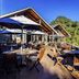 Grand Mercure Puka Park Resort in Pauanui Beach with outdoor deck dining and forest views